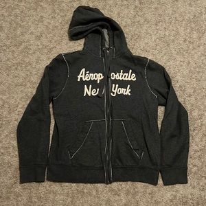 Zip up jacket with side pockets and hood.